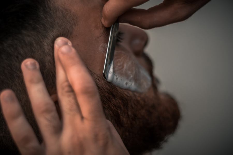 Cut-throat razor shave with hot lather